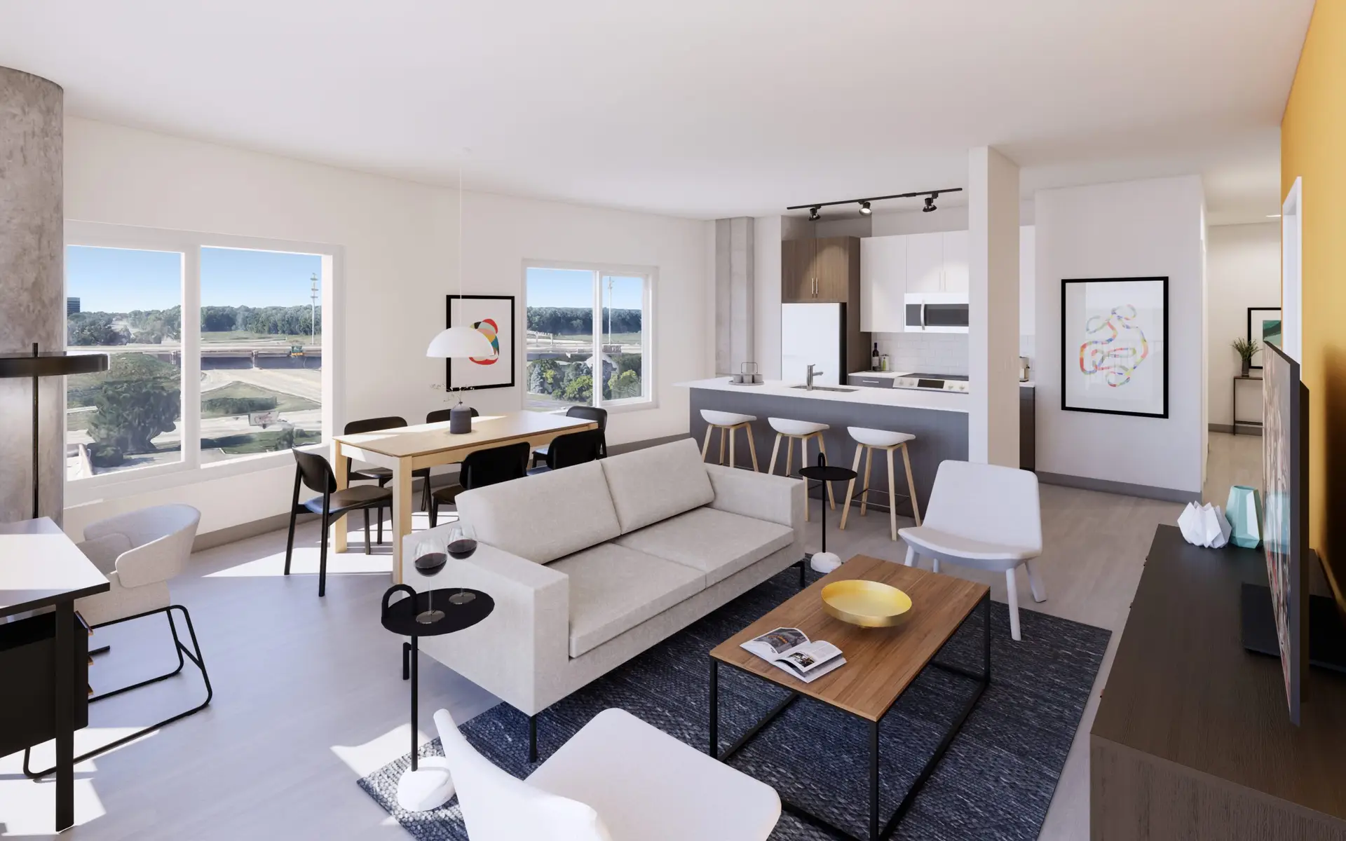Modern living room and kitchen area with large windows and stylish furniture.